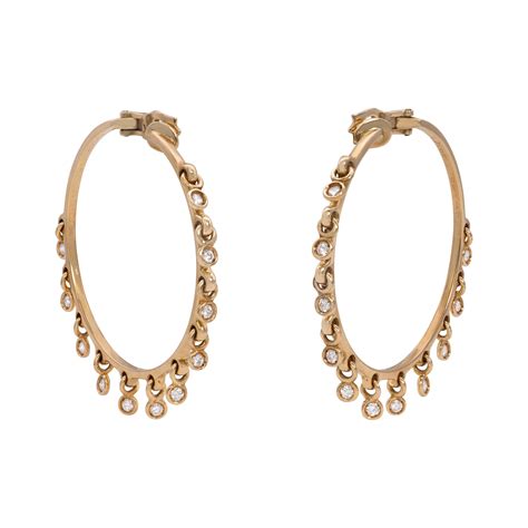 christian dior gold hoop earrings.